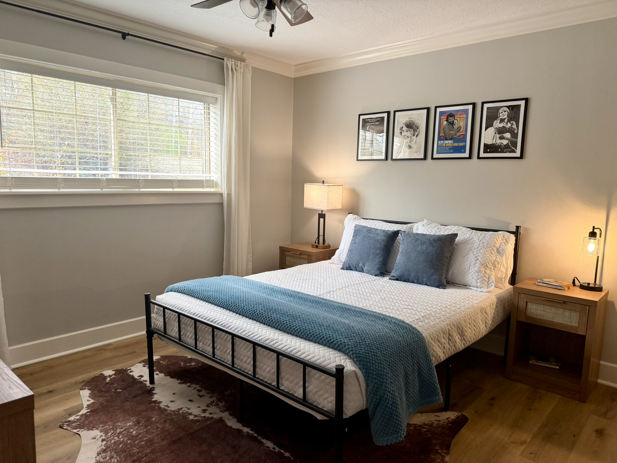 Bedroom three alternate view with blue bedding and metal bed frame