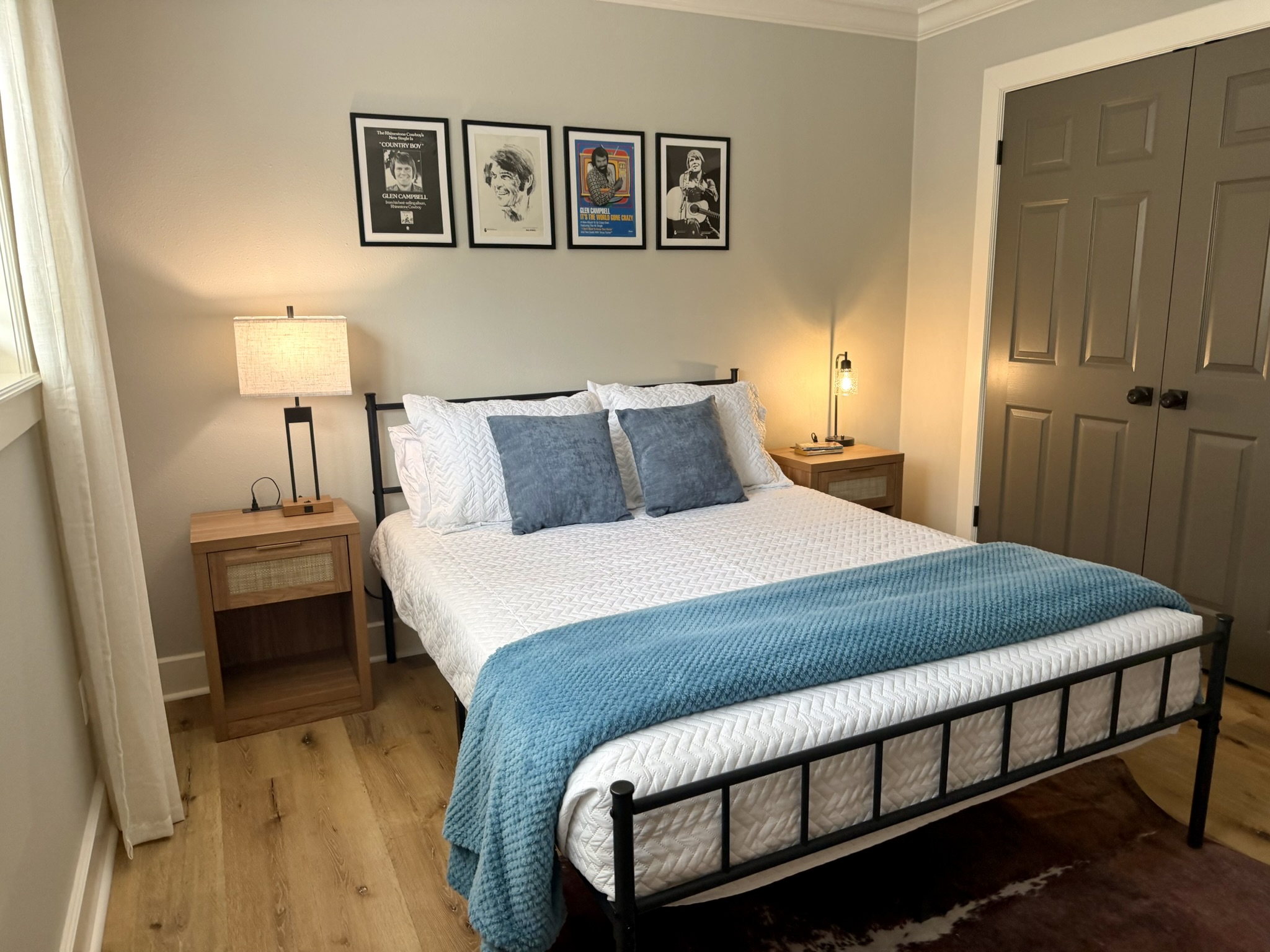 Southern Delight third bedroom with queen bed and Glen Campbell framed prints