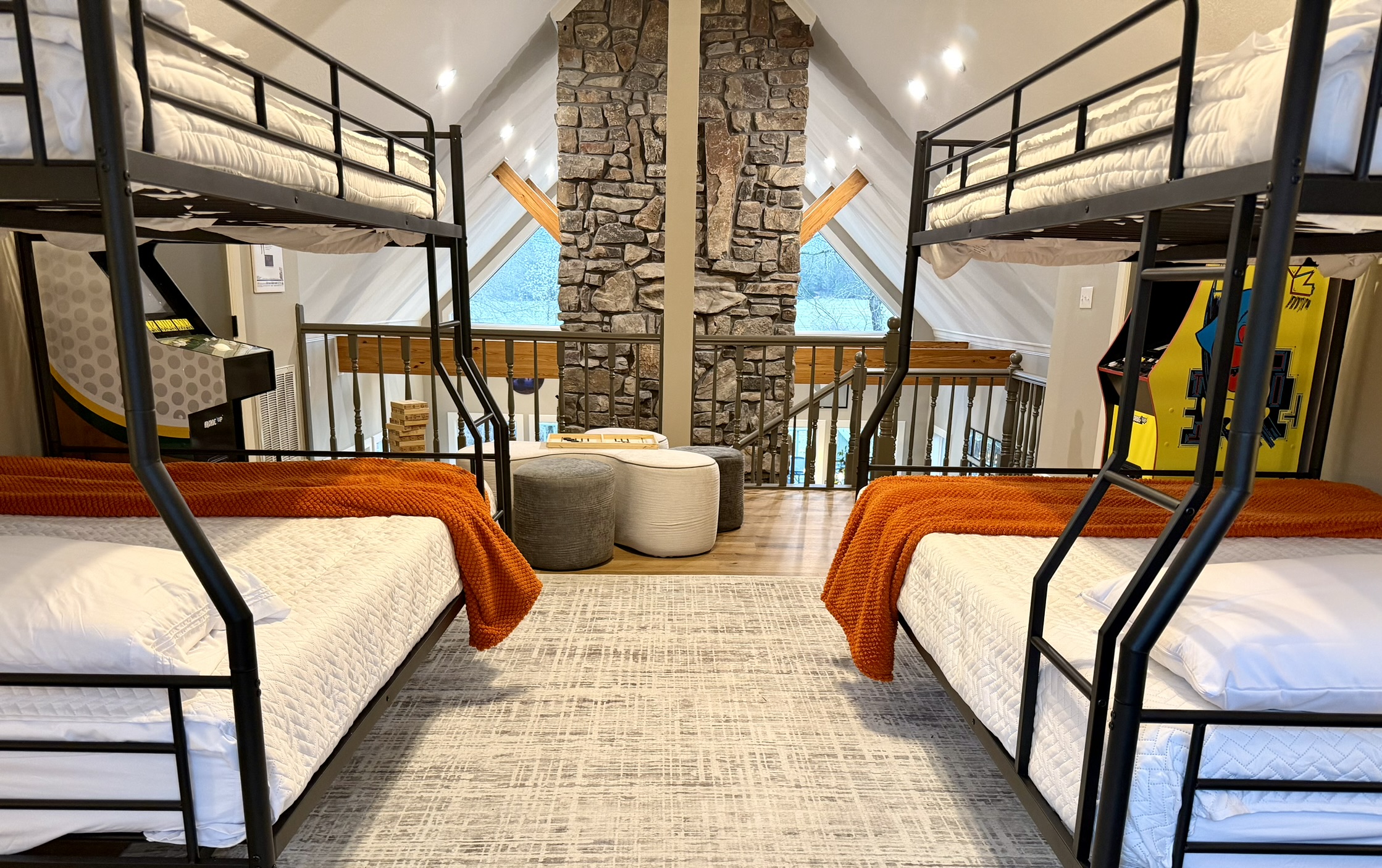 Open loft staircase landing with colorful decor and comfortable seating