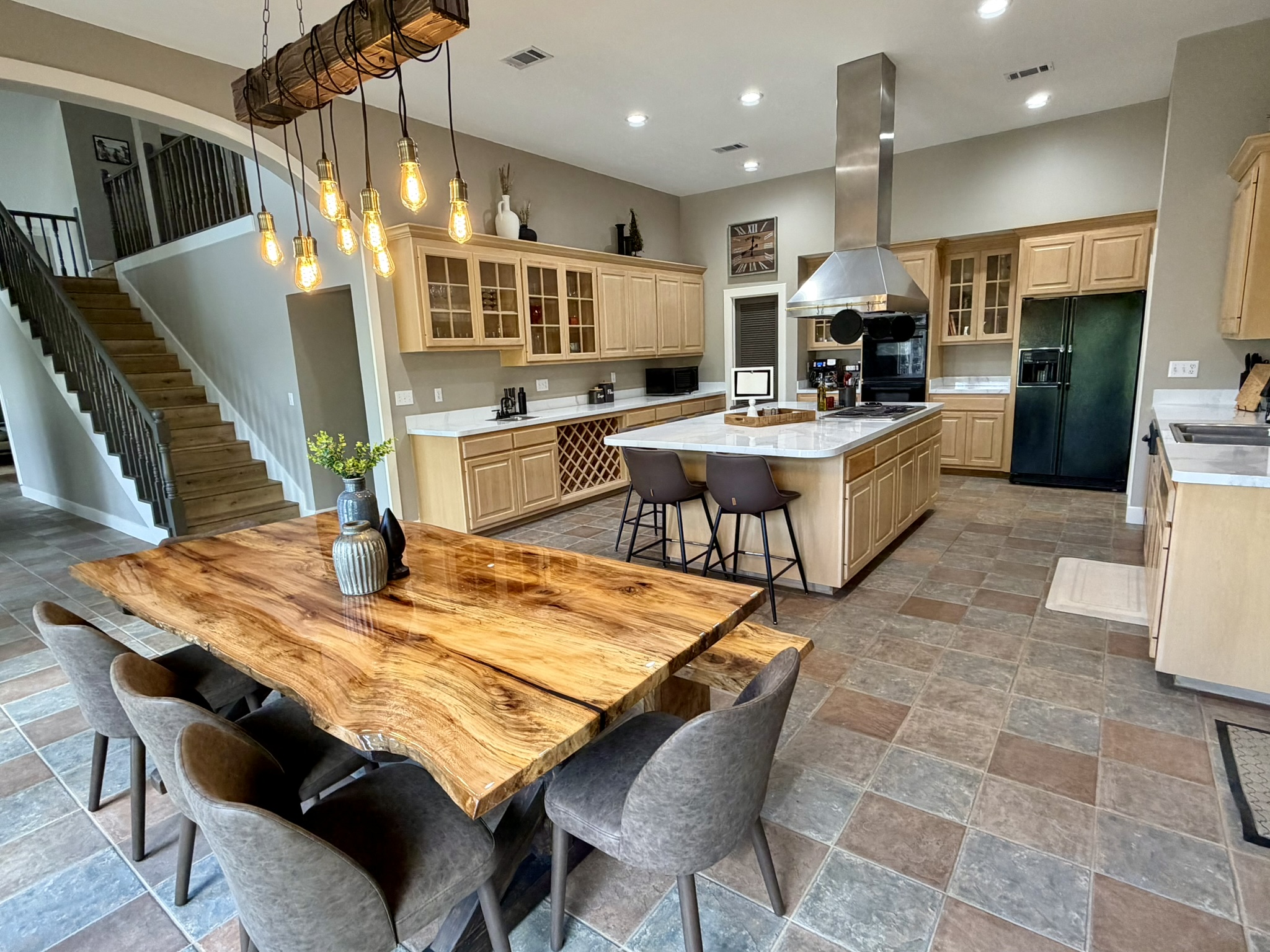 Southern Delight kitchen and sycamore dining table with Edison bulb chandelier