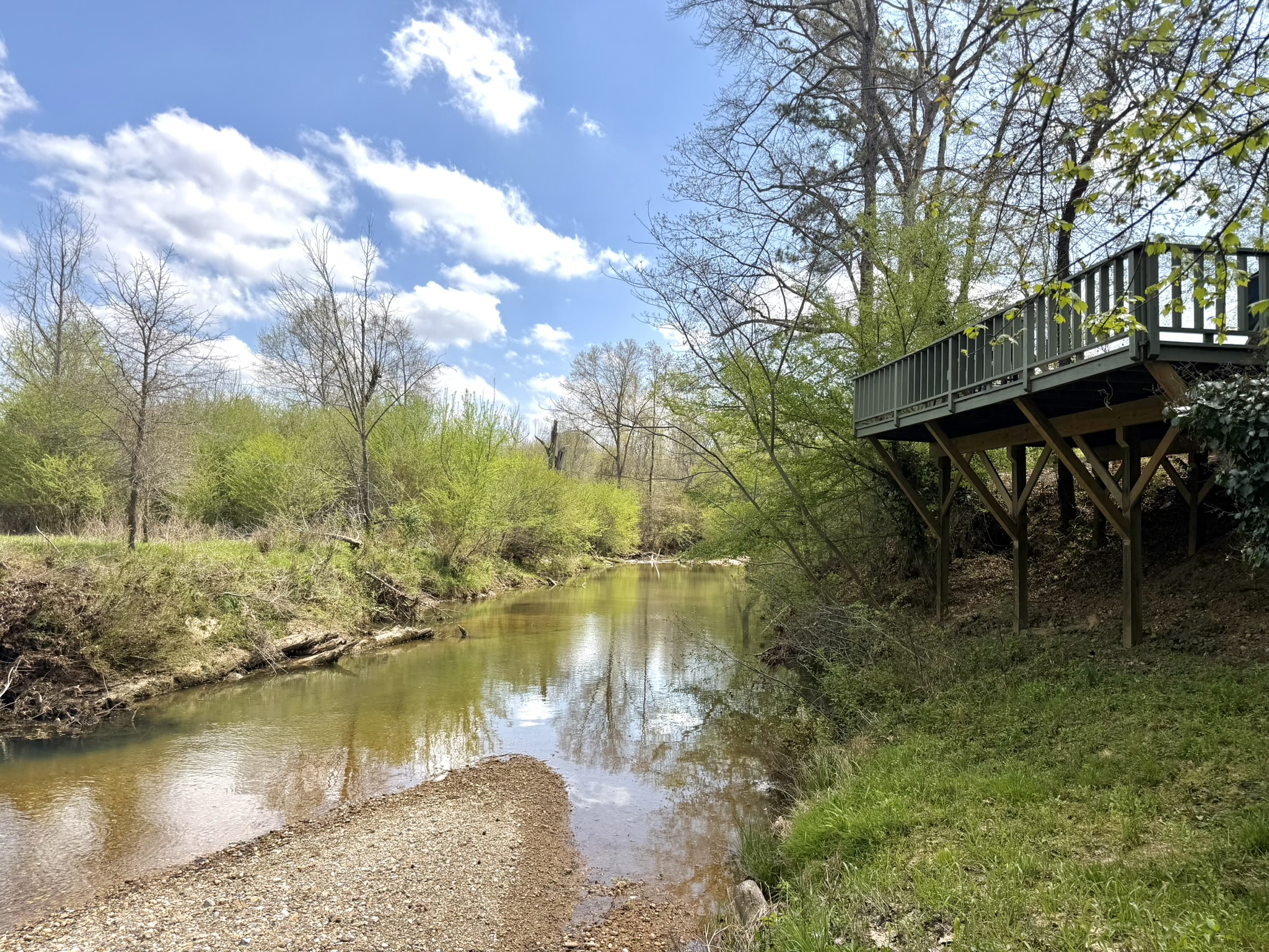 Saline Creek flowing beneath the Southern Delight deck in spring